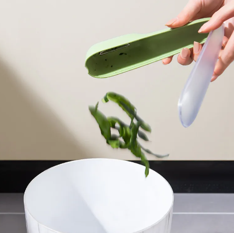 Peeler with Peel-Catching Storage Tube – No Mess on the Counter